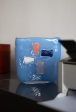 Blue glass vase with glass shaped