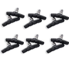 Discountershop 6 set Universele Rubberen Fiets V Remblokken Set - 6 Paar – 12 Stuks – 70mm | Rubber Remblokjes | Fietsen Remblok | Remblokkenset | Remblokset Geschikt voor Mountainbike, Stadsfiets, Vouwfiets en Tourfiets Discountershop 6 set Universele Rubberen Fiets V Remblokken Set - 6 Paar – 12 Stuks – 70mm | Rubber Remblokjes | Fietsen Remblok | Remblokkenset | Remblokset Geschikt voor Mountainbike, Stadsfiets, Vouwfiets en Tourfiets