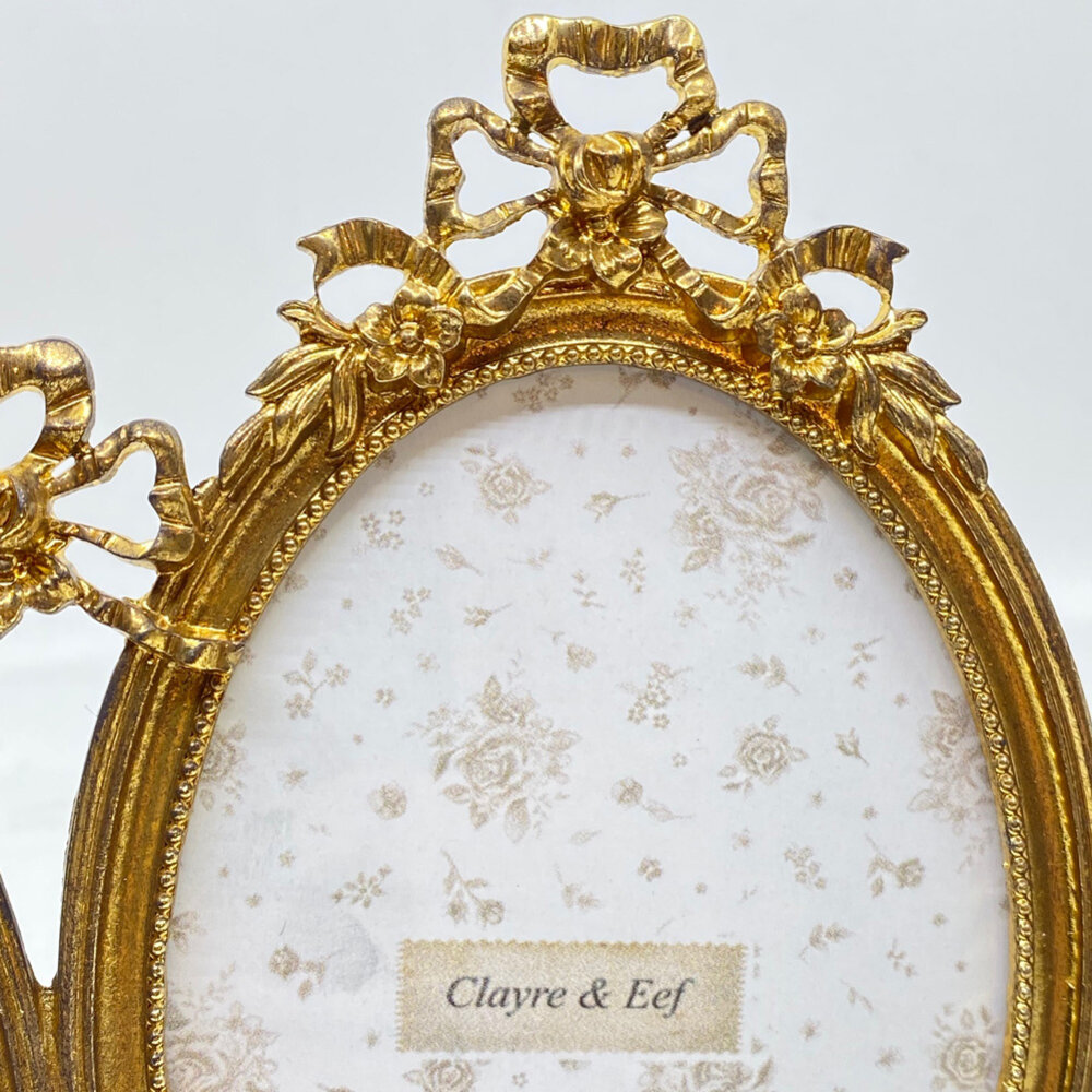 Melting Pot - Fotolijstje Duo Ovaal Strik Goud Metaal 21x16cm - foto 8x13cm Melting Pot - Fotolijstje Duo Ovaal Strik Goud Metaal 21x16cm - foto 8x13cm