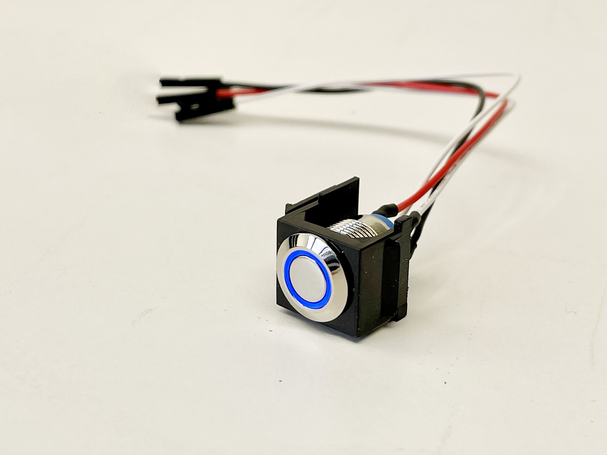 Snap-in momentary push button switch with a blue LED ring 3-9V