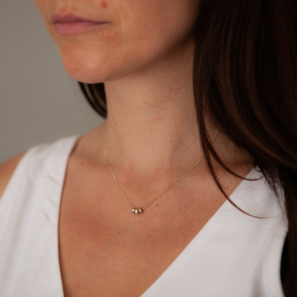 Tri shop gold necklace