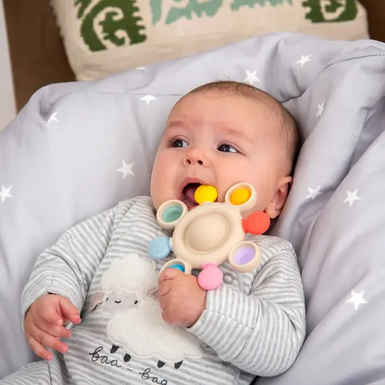 Tickit Tickit | Silisoft Drucklöcher Beißspielzeug Regenbogenfarben