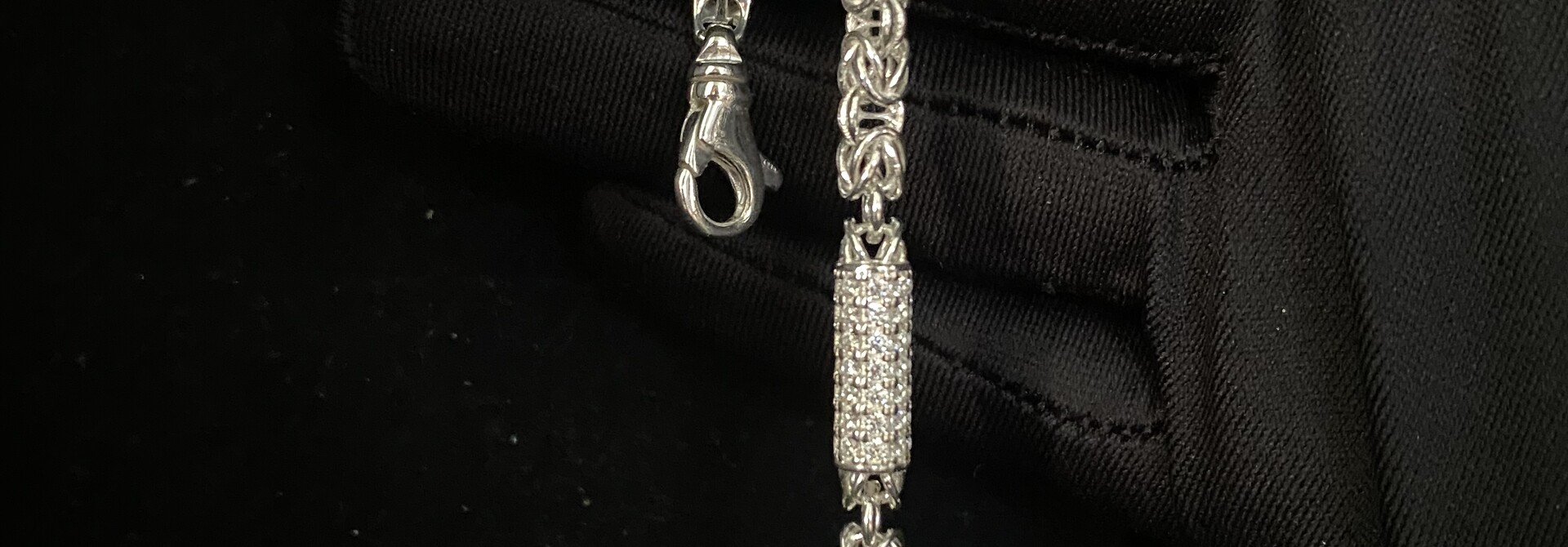 Armband zilver keizerschakel met tussenstukjes clean of bezet met zirkonia's