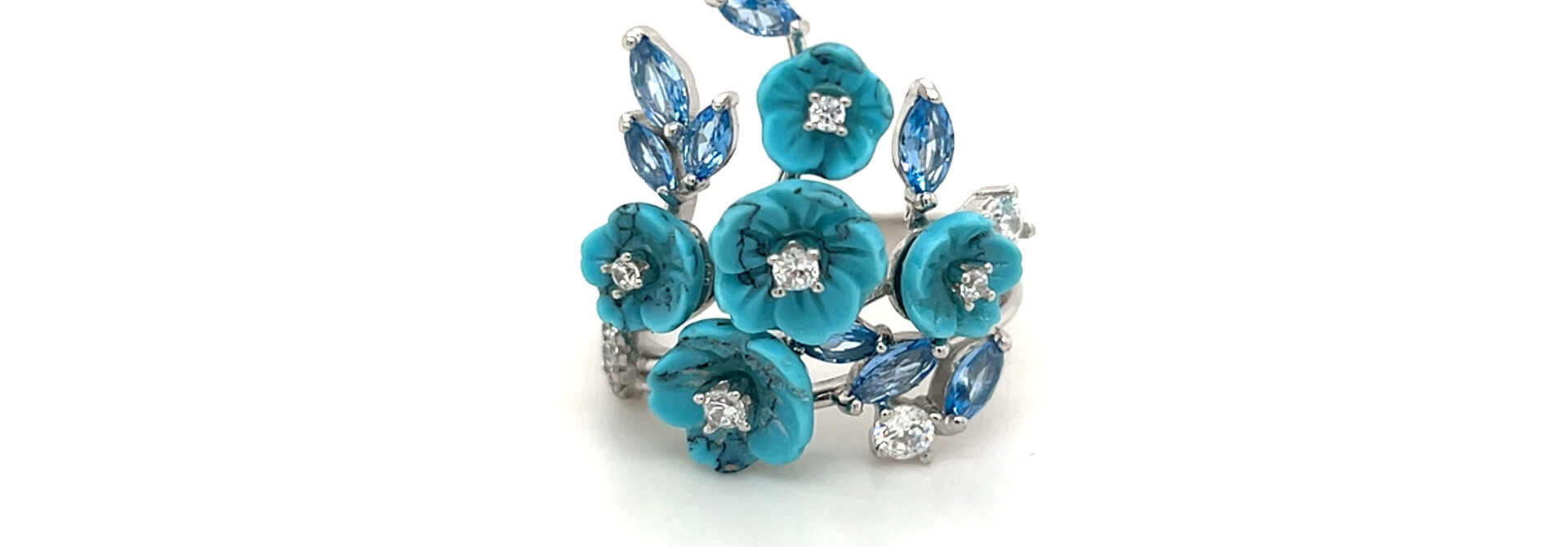 Ring artistieke vorm met blauwe stenen en bloemen