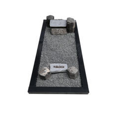 Grafstenen basaltblokken met omranding