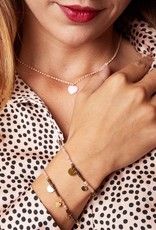 Roze armband met gouden muntjes