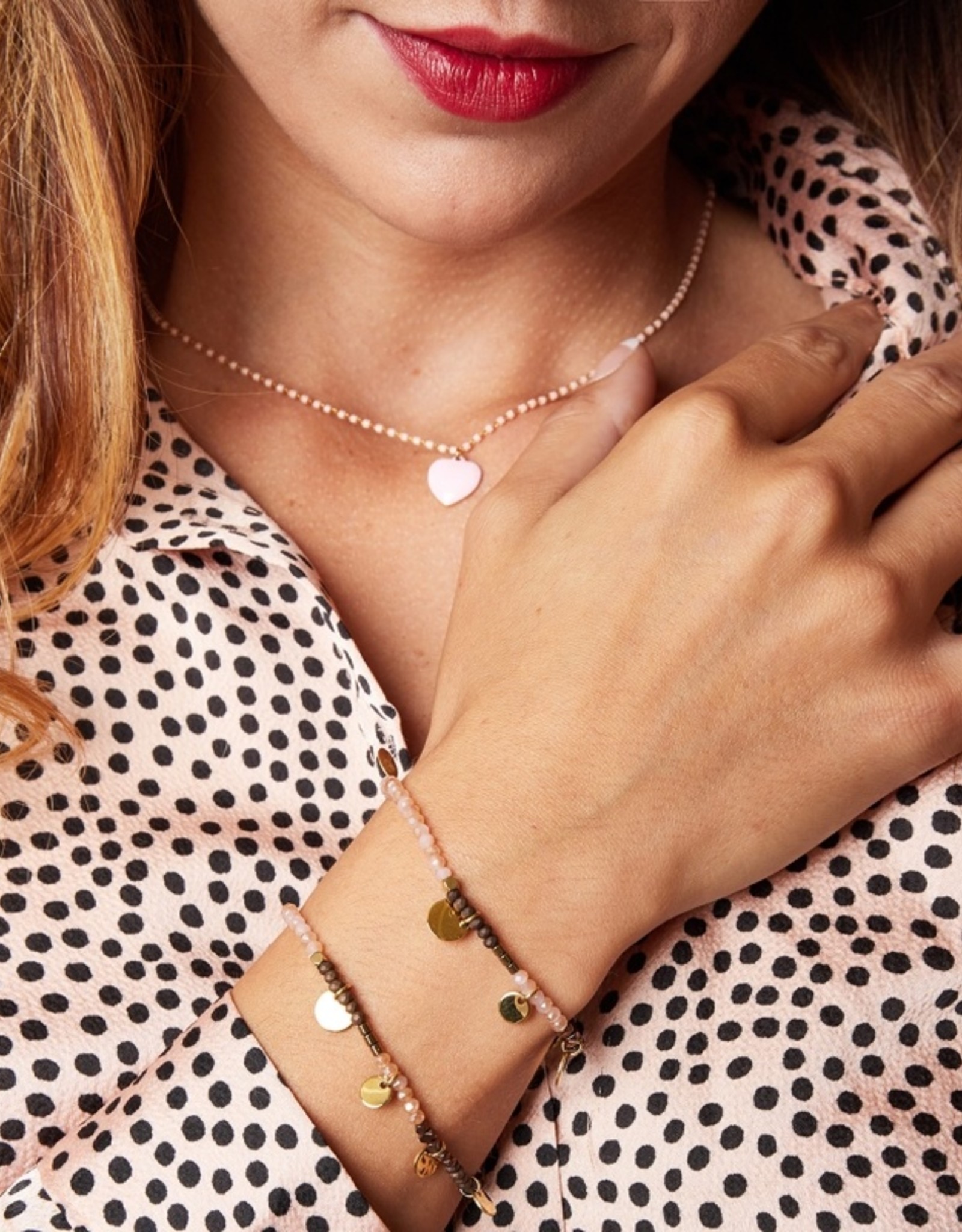 Roze armband met gouden muntjes