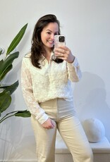 Creme blouse met vlokjes