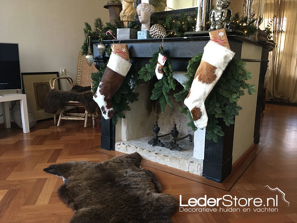 Cowhide Christmas socks to fireplace Nico 3