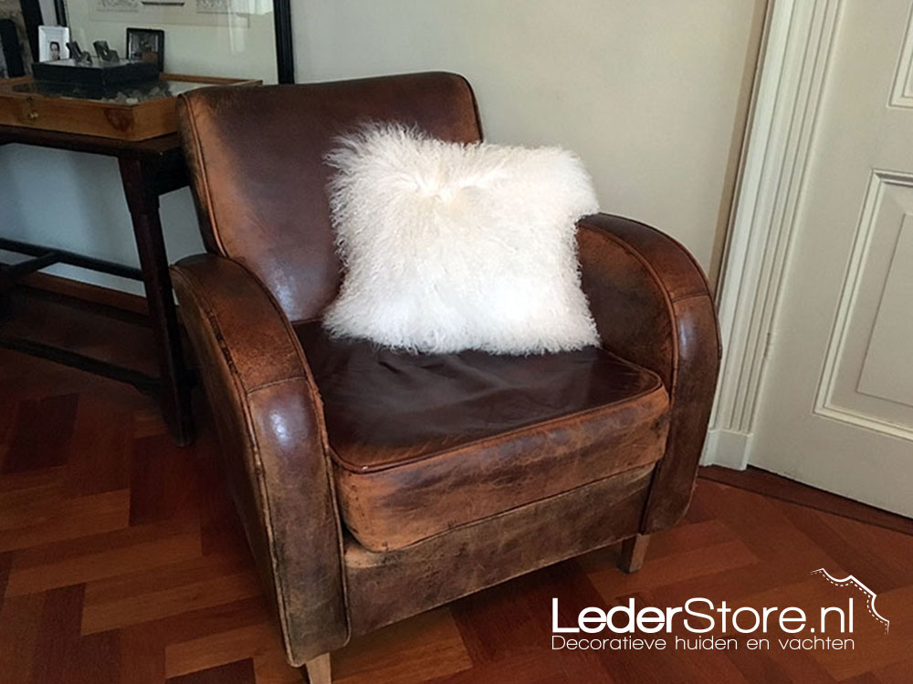 Sheepskin pillow in chair