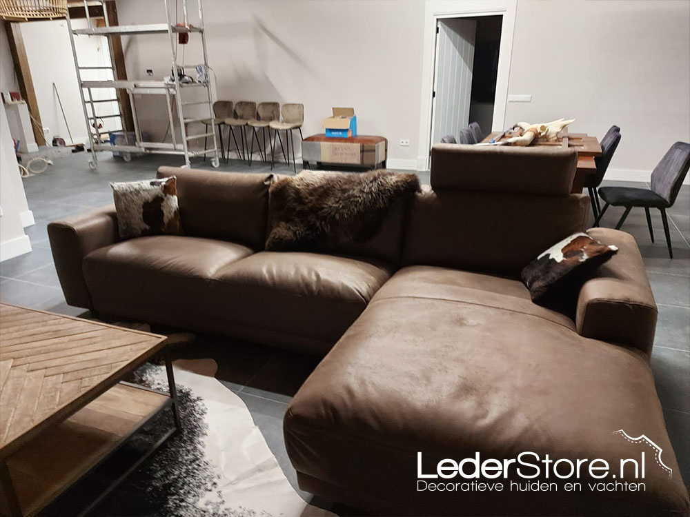 Cowhide in living room David sheepskin on sofa