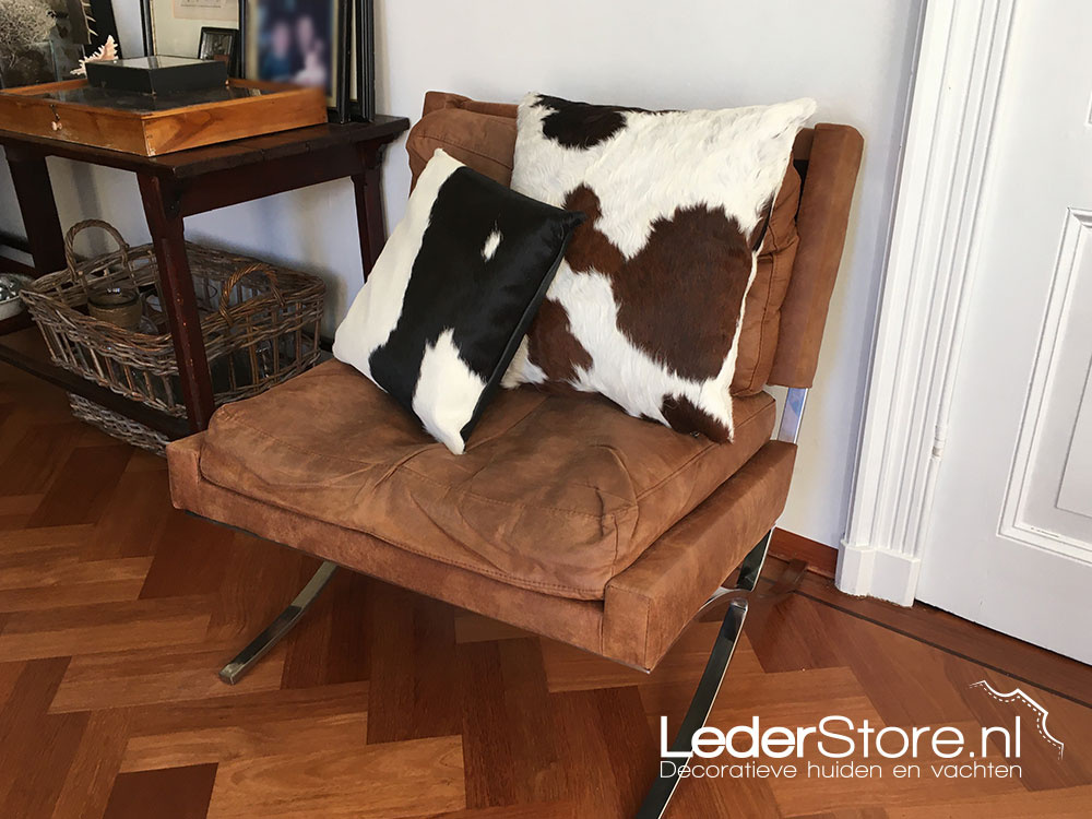 Cowhide cushions black white and tricolor on chair