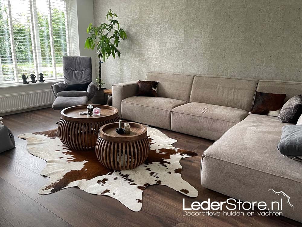 Cowhide in living room with cowhide cushions on sofa Yvette 2