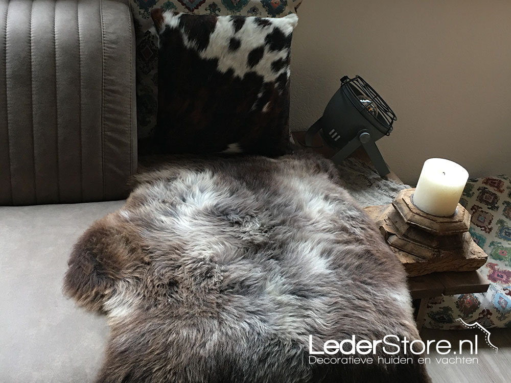 Sheepskin brown gray on sofa with cow pads Agnes