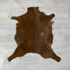 Geitenhuid bruin wit 85x75cm