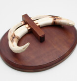 Tanden WRATTENZWIJN op hardhouten schild