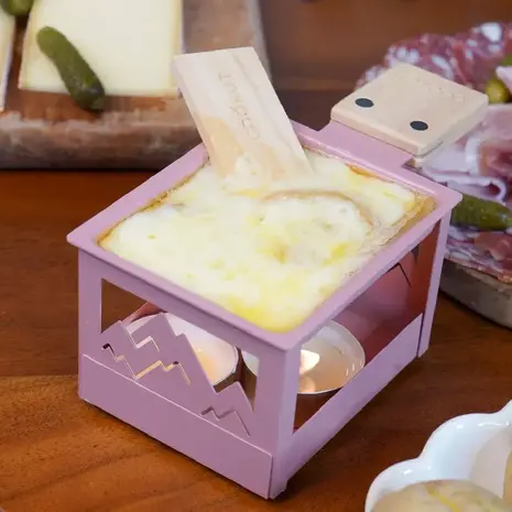 https://cdn.webshopapp.com/shops/284479/files/445177468/600x465x3/cookut-raclette-a-la-bougie-yeti-rose-cookut.jpg