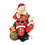 Goodwill zittende Kerstman figuur met ganzenveer en cadeau zak 13 cm