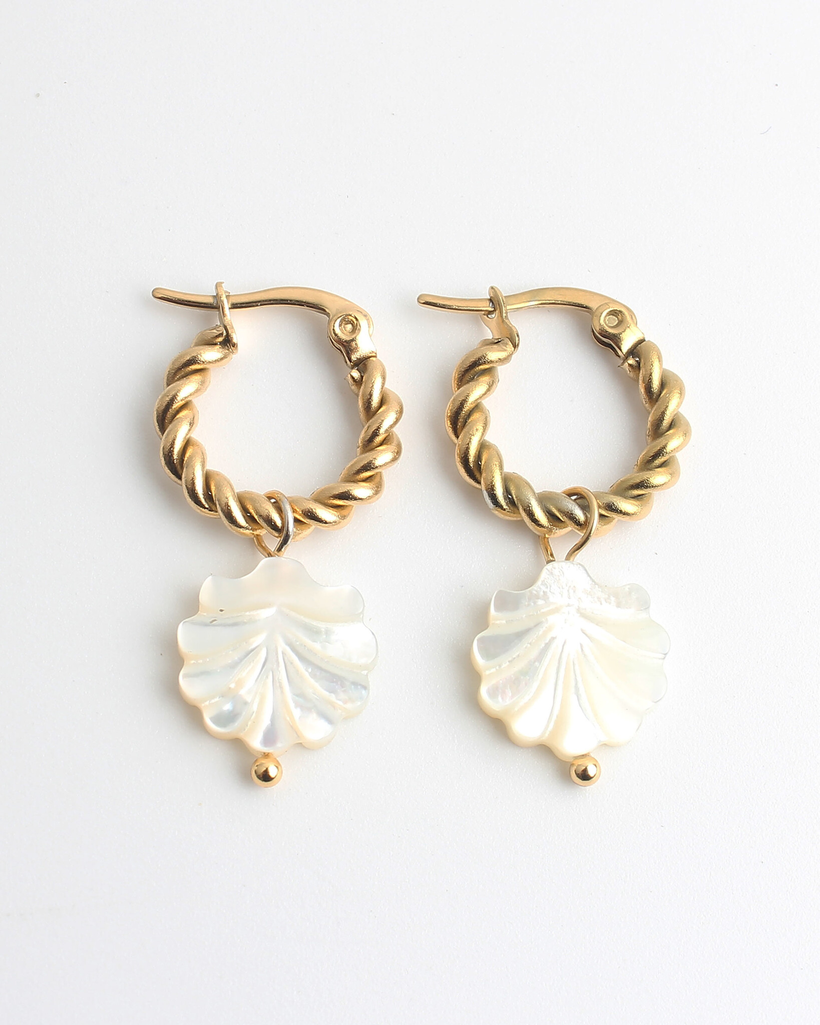 Steel & Shell based pearl earrings Steel & Shell based pearl earrings