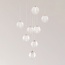 Suspension Aedon 8 lumières - globes blancs aux détails dorés