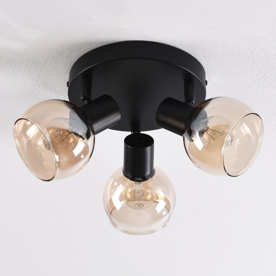 Plafonnier noir Peri avec 3 spots en verre ambré orientables