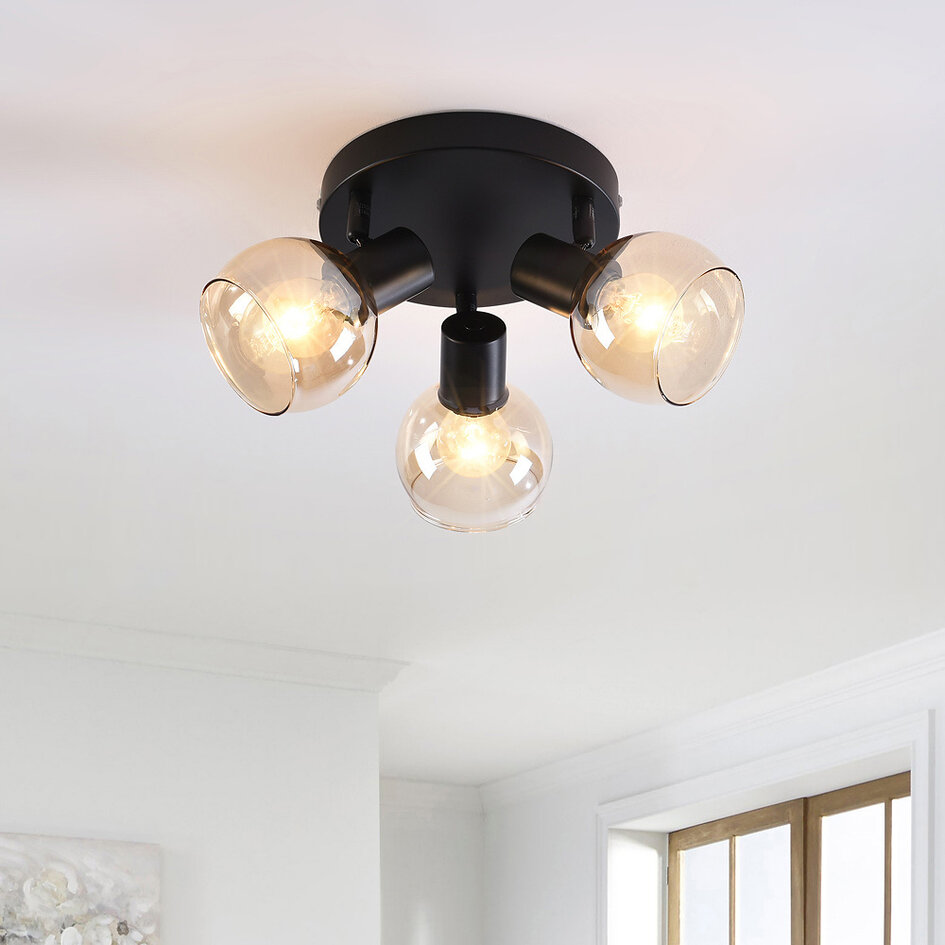Plafonnier noir Peri avec 3 spots en verre ambré orientables