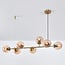 Suspension design 7 lumières Sette - verre ambré et doré