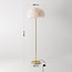 Lampadaire design Evania avec plumes blanches et pied en laiton doré