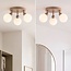 Plafonnier Zano à 3 points lumineux pivotants en beige sable et verre blanc laiteux