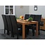Eiken eettafel massief met 6 zwarte stoelen Giessen