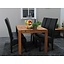 Eiken eettafel massief met 6 zwarte stoelen Giessen