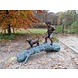 Eliassen Image bronze boy with dog on tree Eliassen Image bronze boy with dog on tree