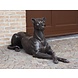 Bronzen liggende hond links Bronzen liggende hond links