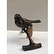 Bronze sculpture sparrow on branch Bronze sculpture sparrow on branch