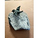 Bronze bird spread wings on stone Bronze bird spread wings on stone