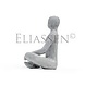 Man meditating sitting on cube Man meditating sitting on cube