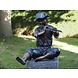 Bronzen beeld Jongen met fluit zittend Bronzen beeld Jongen met fluit zittend