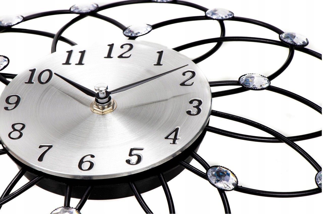 Merkloos Wandklok in bloemvorm - Zwart/Zilverkleur - 30 centimeter Merkloos Wandklok in bloemvorm - Zwart/Zilverkleur - 30 centimeter