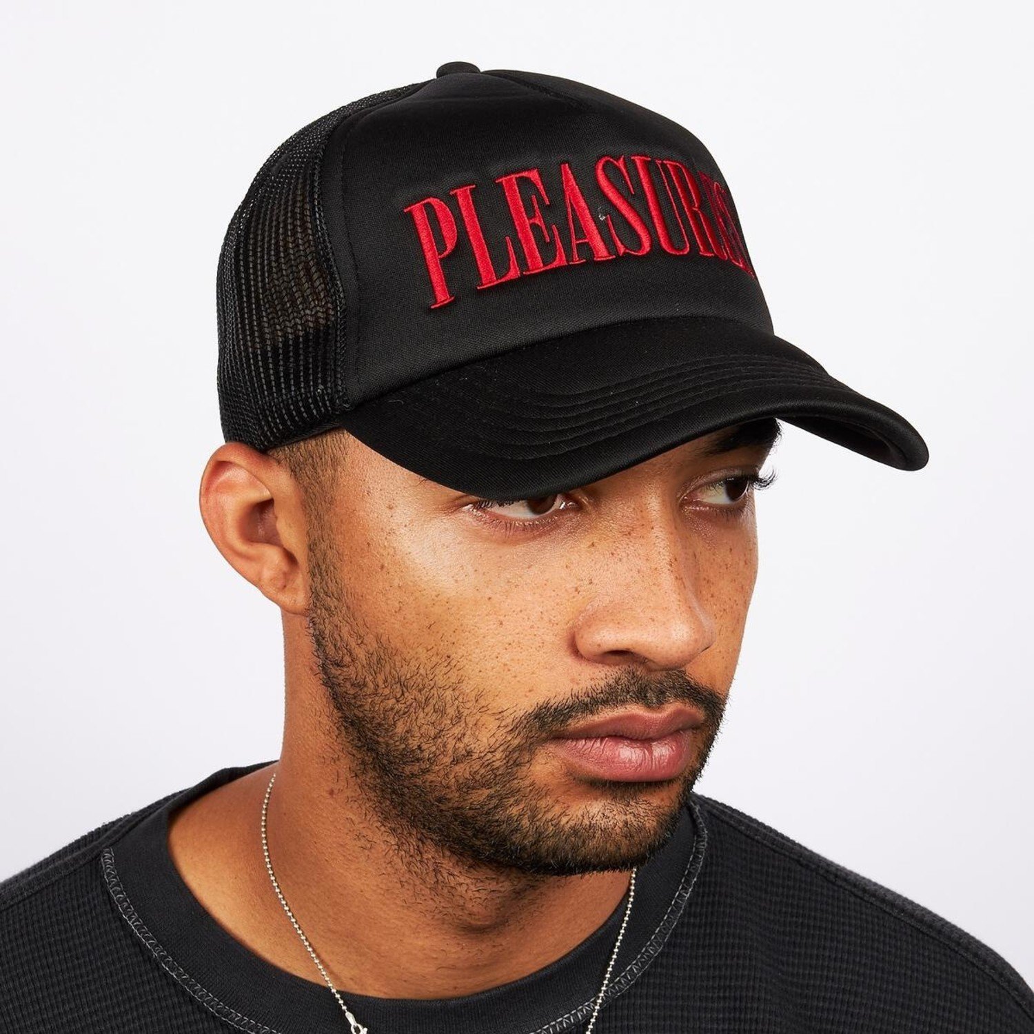 https://cdn.webshopapp.com/shops/290535/files/408614015/1500x4000x3/pleasures-lithium-trucker-cap-black-red.jpg