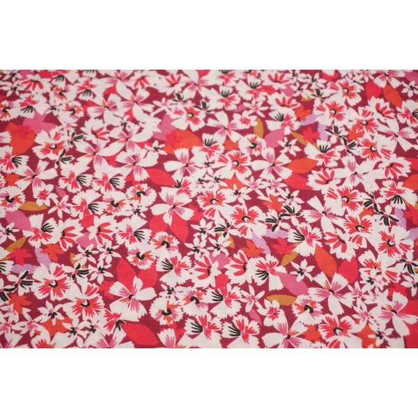 Polyester tricot paars met bloemen