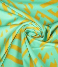  Polyester twill mintgroen met hoekige vormen