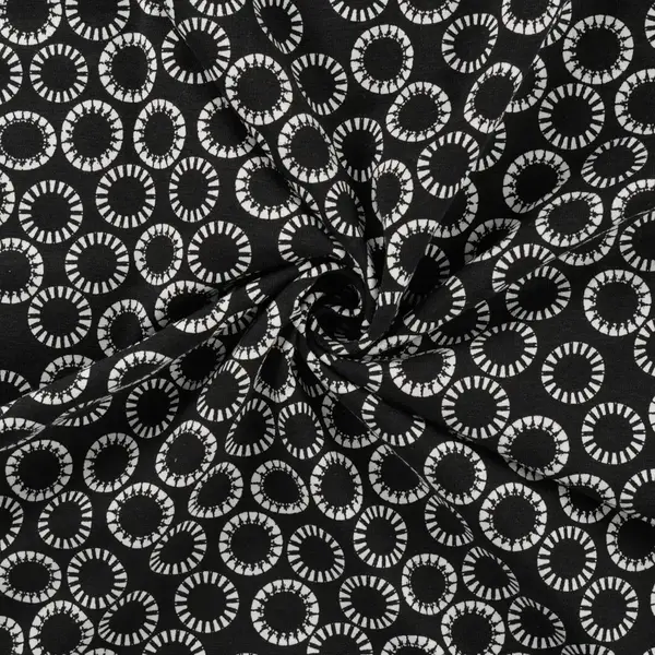 Zwarte tricot stof met witte cirkels