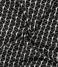  Katoenen tricot met zwart witte driehoekjes