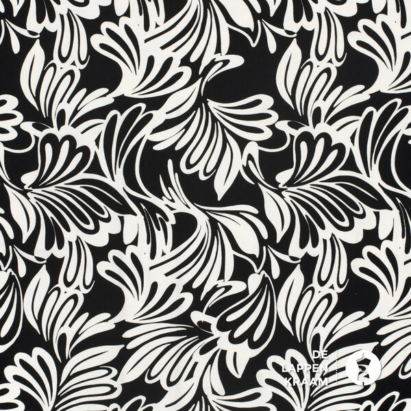 Tricot stof in zwart wit met psychedelische print