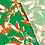 SALE Stretch viscose in linnenlook groen met wit/oranje bladeren
