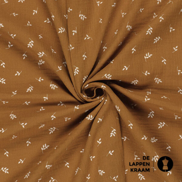 Mousseline stof met print van witte blaadjes in caramel