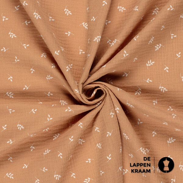 Mousseline stof met print van witte blaadjes in biscuit