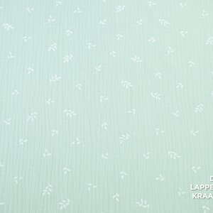 Mousseline met print van witte blaadjes in mintgroen