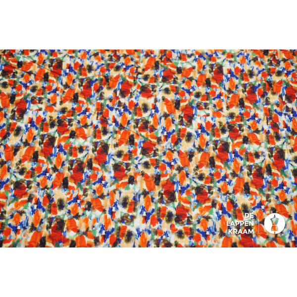 Coupon 107 Viscose stretch met oranje verfvlekjes 170 x 150 cm