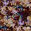 Viscose met gestyleerde bloemenprint in rood en bruintinten